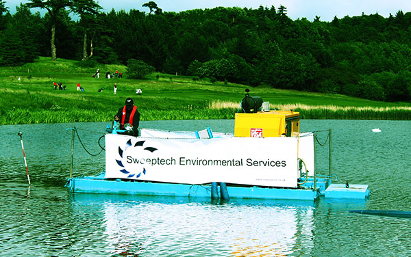 Sweeptech desilting a lake from a floating jetty