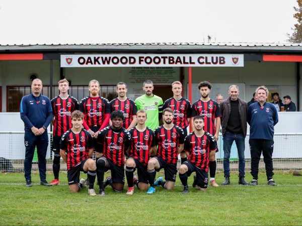 Oakwood FC 2022 team photo with players in black and red football kit